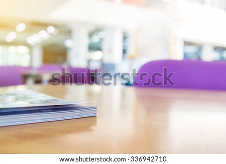 library with table desk and books defocused background.