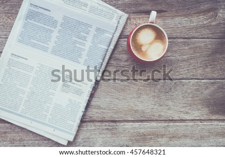 cup of coffee with Newspaper in coffee shop.