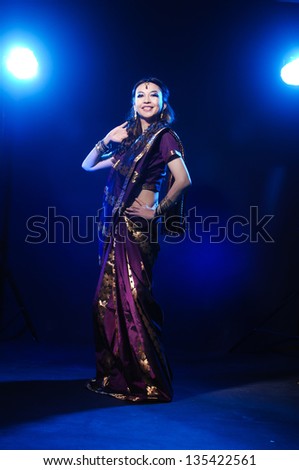 Full length of beautiful female wearing traditional indian costume, isolated on light background Full length of beautiful female wearing traditional indian costume, isolated on light background