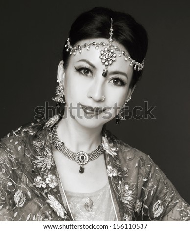 portrait of asian woman in traditional clothing with bridal makeup and jewelry.- shot black and whit