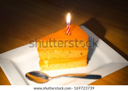 Dessert - happy birth day Cake with red candle  .