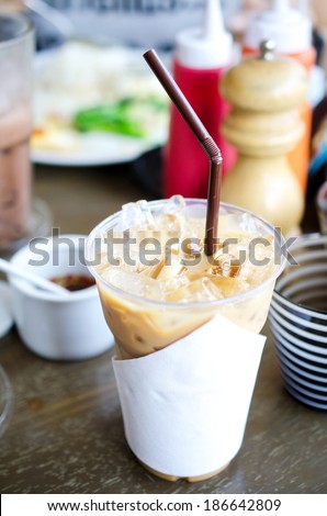 cappuchino iced coffee on table in afternoon time .