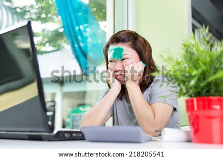 beautiful asian woman using laptop computer on work table , lose one\'s mind