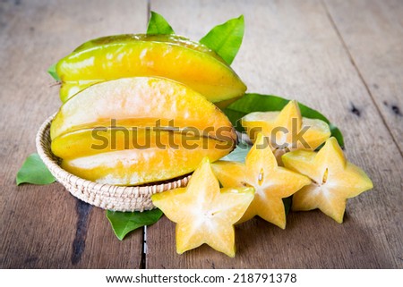 Star fruit on wood background .