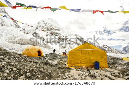 Tents in Everest Base Camp in cloudy day. Here starts the climb to reach the top of the highest mountain in the world, Everest Region, Sagarmatha National Park, Himalayas, Nepal