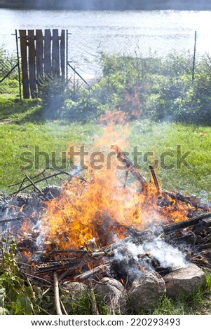 Garbage in fire, illegal garden burning out.
