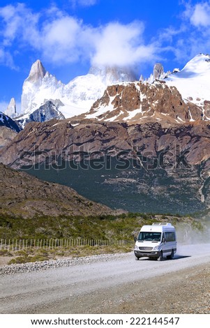 Touristic car on road in Fitz Roy Mountain Range, Los Glaciares National Park, Argentina.