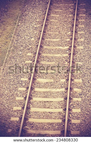Vintage retro filtered picture of railway tracks.