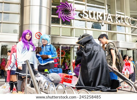 KUALA LUMPUR, MALAYSIA - DECEMBER 27, 2014: Fans in costumes waiting for opening the 2014 Comic Fiesta in Kuala Lumpur Convention Centre (event location).