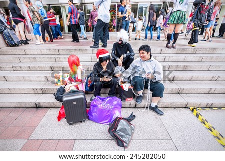 KUALA LUMPUR, MALAYSIA - DECEMBER 27, 2014: Fans in costumes waiting for opening the 2014 Comic Fiesta in Kuala Lumpur Convention Centre (event location).
