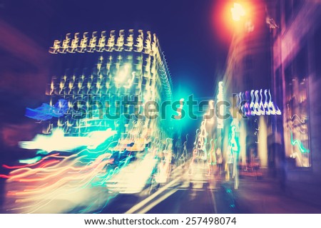 Retro filtered city traffic lights motion blurred.