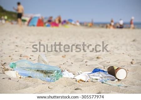 Garbage on a beach left by tourist, environmental pollution concept picture, Baltic Sea coast, Poland.