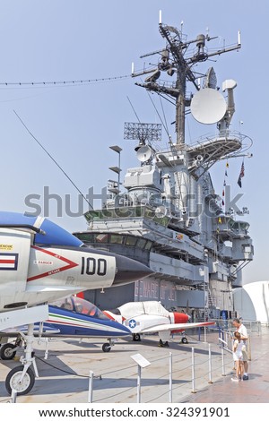 NEW YORK, USA - AUGUST 17, 2015: People visiting Intrepid Sea, Air and Space Museum in New York. Museum was founded in 1982 onboard the USS Intrepid, retired aircraft carrier.