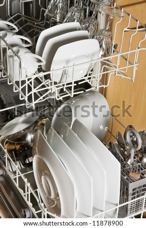 Dishwasher with clean white dishes