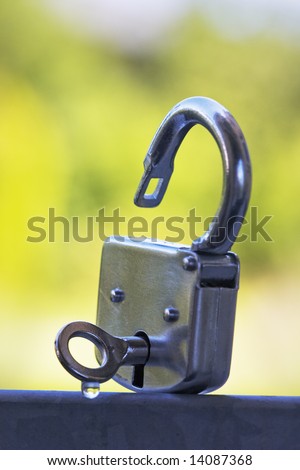 Open metal Padlock with key