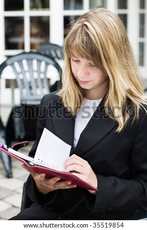 Teenage girl with personal organizer