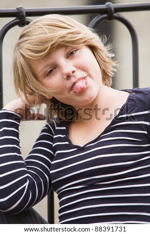 Girl sticking out tongue and smiling