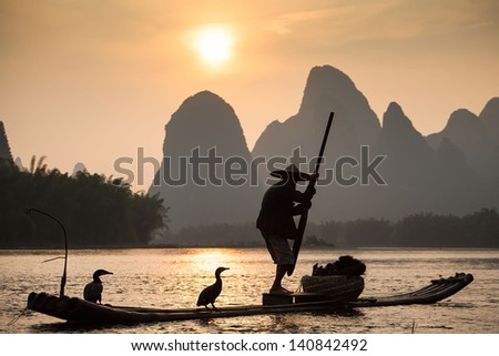 Boat With Cormorants Birds, Traditional Fishing In China Use Trained Cormorants To Fish, Yangshuo, China
