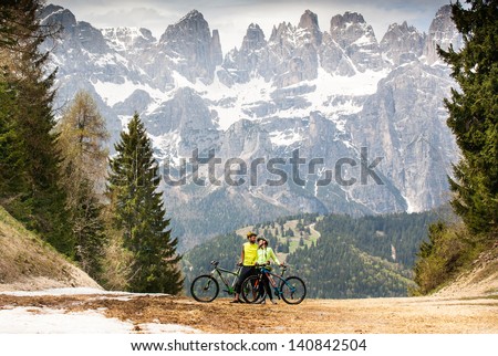 friends on a bike ride in the woods in the mountains of the Dolomites. Italy.