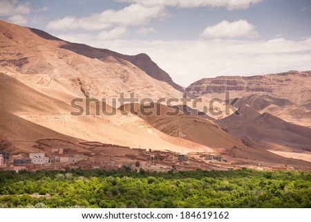 Morocco - Atlas Mountain Village - Draa Valley in the mountains. Background blue sky with clouds. Beautiful world.