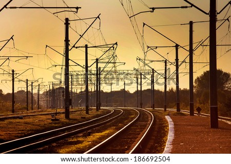 urban railway track with confusing lines and overhead cables