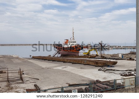 red ship in a dry dock