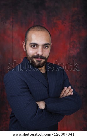 Bearded bald man posing