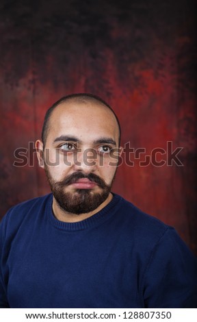 Bearded bald man posing