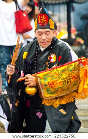 LUKANG, TAIWAN - circa MAY 2014: Ji Gong deity medium performs ritual blessings during a Mazu(Matsu) Festival in Tian Hou Temple, Lukang, Taiwan.