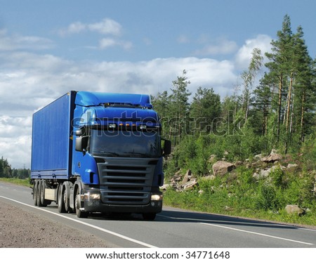 blue truck on country highway