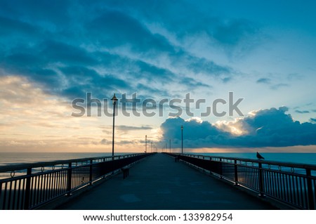 Fantastic sunrise over Pacific ocean at New Brighton Pier, Christchurch, New Zealand