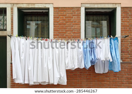 Fresh and clean clothes at window line