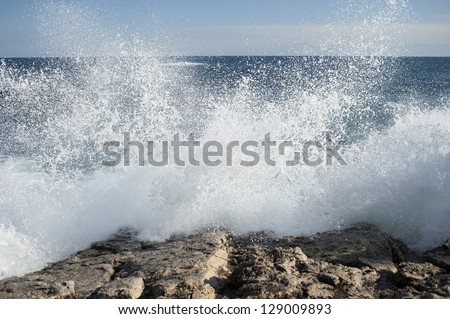 Italy. rocks and waves. Off the coast of syracuse