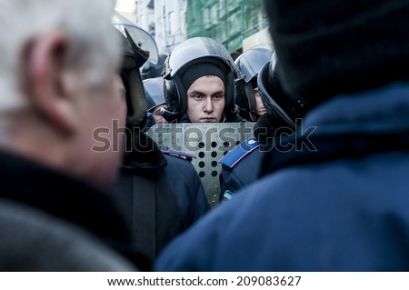 Kiev, Ukraine, 24 December 2013: Maidan - young police guard in stand-off against protesters
