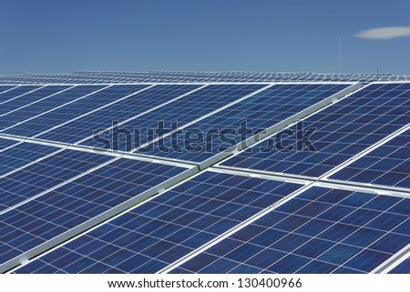 Electric photovoltaic solar panels cells on a field.