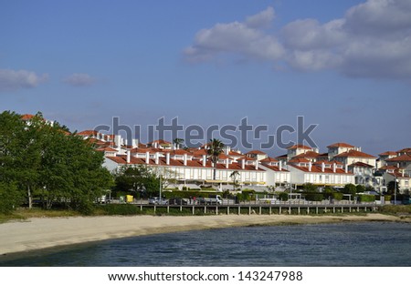 Toxa island with beach, houses and path way. Touristic and famous. Rias Baixas, Galicia, Spain