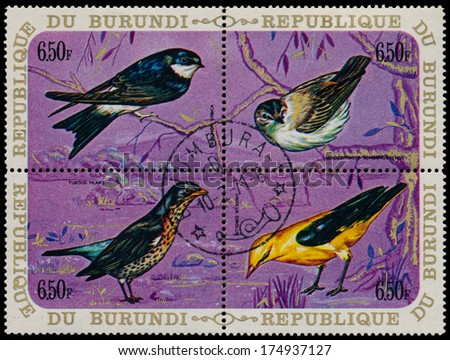BURUNDI - CIRCA 1971: A set of four stamps printed in Burundi, shows a birds Common House Martin, Sedge Warbler, Fieldfare, Eurasian Golden Oriole, circa 1971