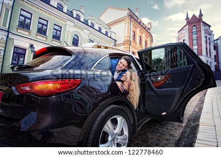 Young beautiful couple end car