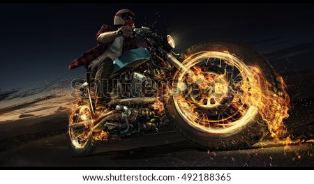 Motorcycle. Biker riding motorcycle on an empty road at the night. Fire and energy