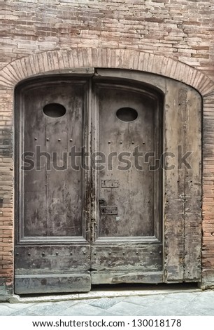 An old door in the city of Siena, tuscany (Italy)