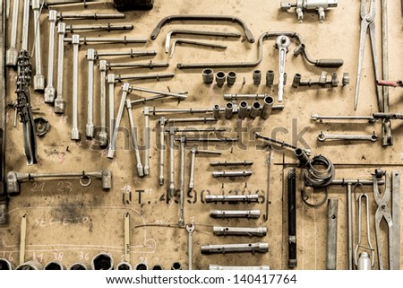 The tools of a workshop hanging on a wall create a pleasant texture.