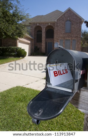 Mailbox filled with monthly house bills
