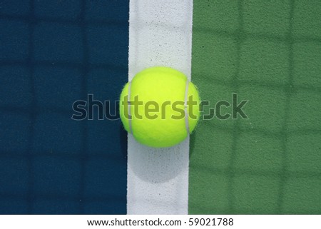 tennis ball in the middle of the boundary line