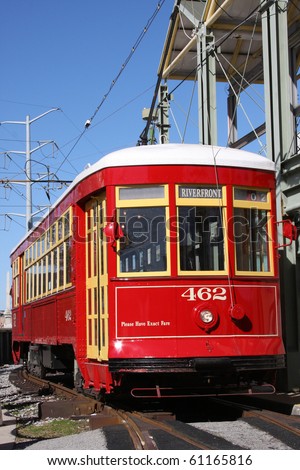 red trolley streetcar on rail in New Orleans French Quarter