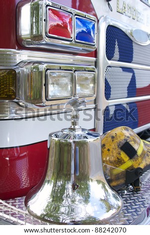 fire truck with bell and hat on the bumper