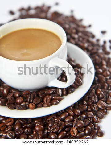 Coffee beans and coffee cup.