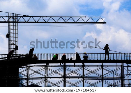 silhouette of construction worker on construction site.