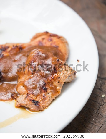 juicy grilled pork chop (neck cut).