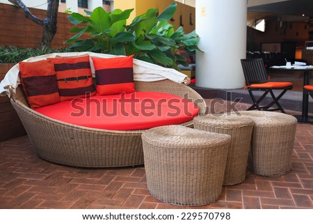 Rattan armchair furniture in garden