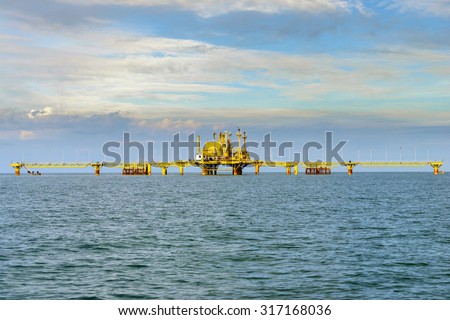 Oil rig platform in the calm sea.